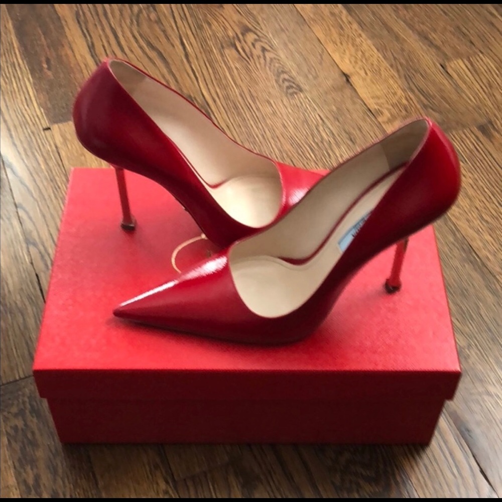 Prada Saffiano red leather pumps with metal heel.